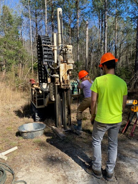 Aaron Barth collecting a stream sediment sample 